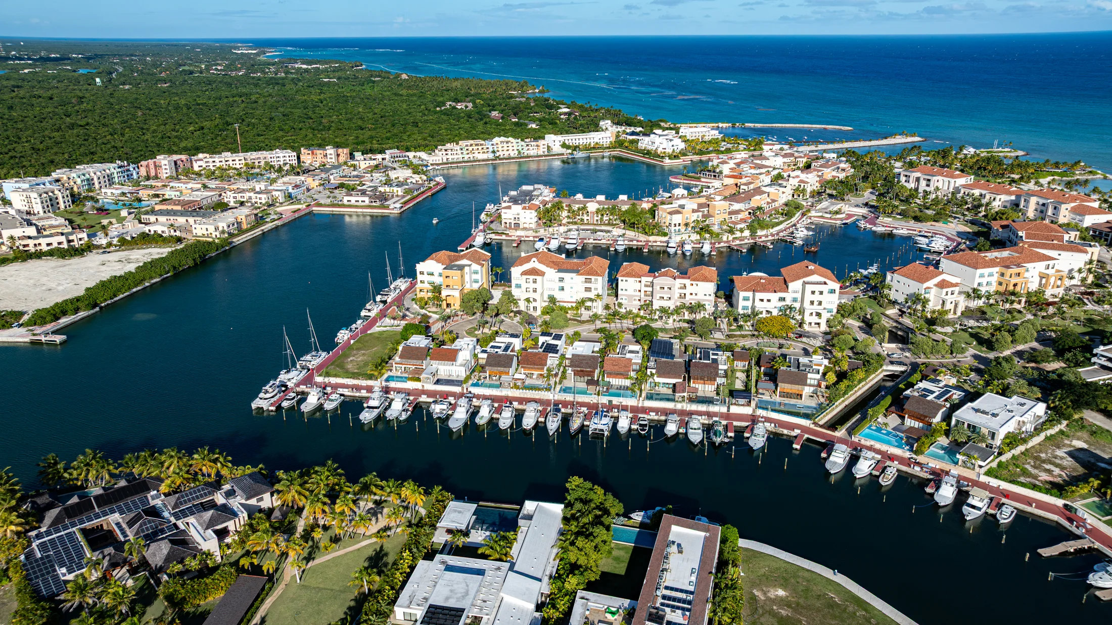 Aerial view of Cap Cana’s marina, waterfront buildings and the Caribbean Sea.